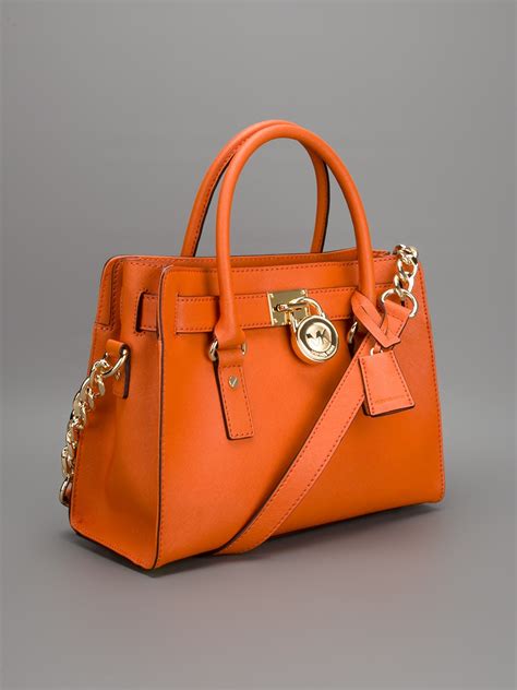 michael kors purses orange.